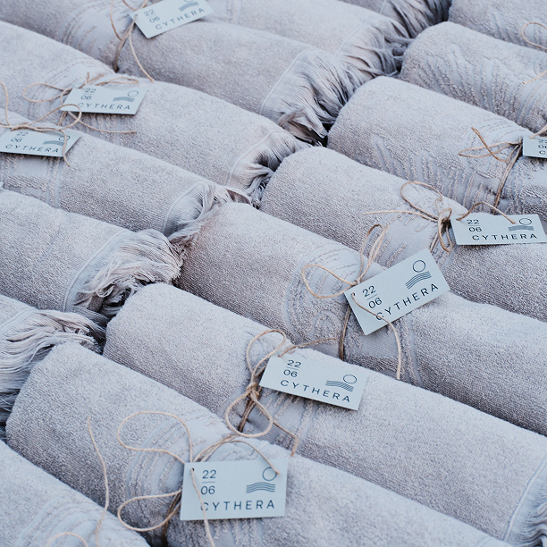 Wrapped towels as thoughtful gifts for guests at a christening, adding a personal touch to the celebration.